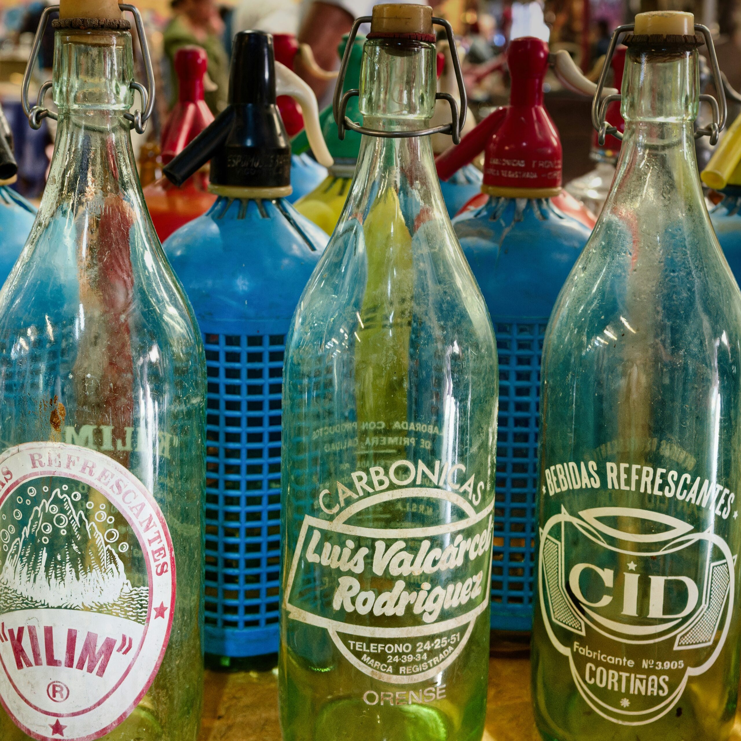 A group of glass bottles sitting on top of a table